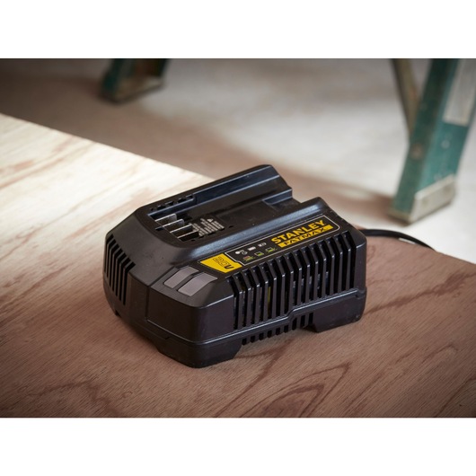 STANLEY FATMAX 20V battery charger on a wood surface